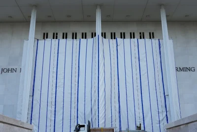 Trump’s name is off Kennedy Center, but a tarp still blocks public view