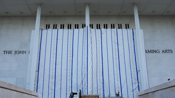 Trump’s name is off Kennedy Center, but a tarp still blocks public view