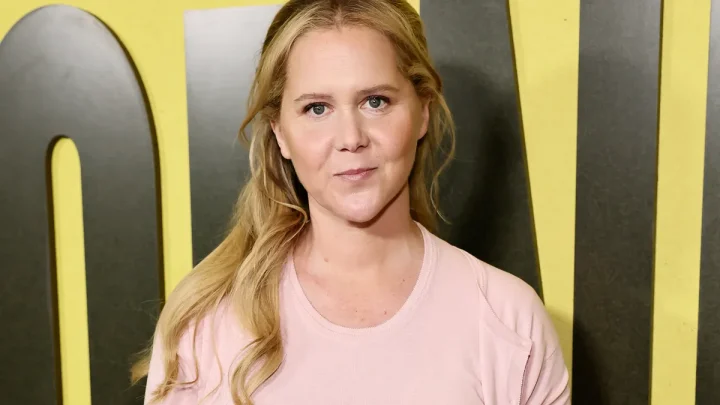 Amy Schumer soaks up July Fourth in a deep-V swimsuit