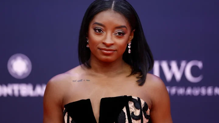 Simone Biles says singer took her YSL shades at Taylor Swift’s wedding